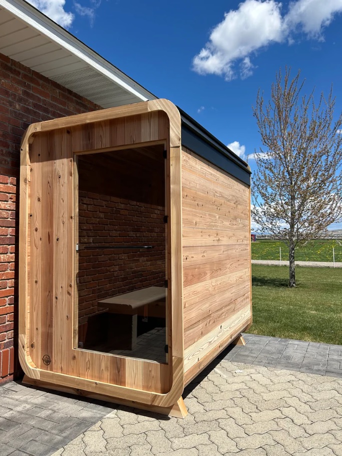 Outdoor barrel sauna installation