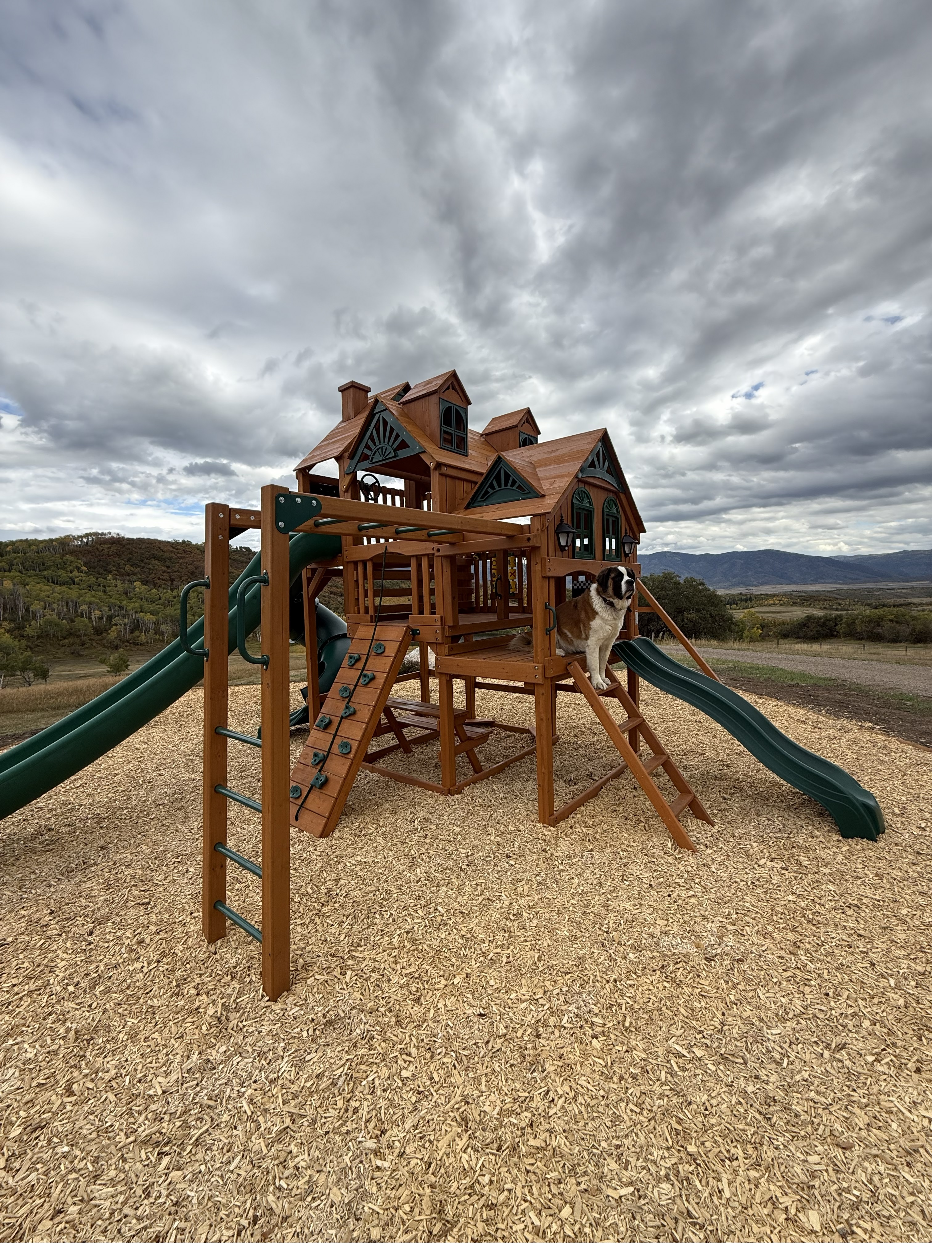 Playset installation in open Colorado landscape